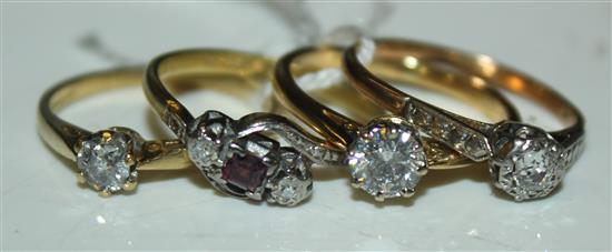 3 diamond solitaire & 1 ruby crossover ring